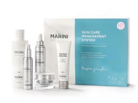 The image shows a skincare set by Marini with various products including bottles, a jar, and a box labeled "Skin Care Management System."