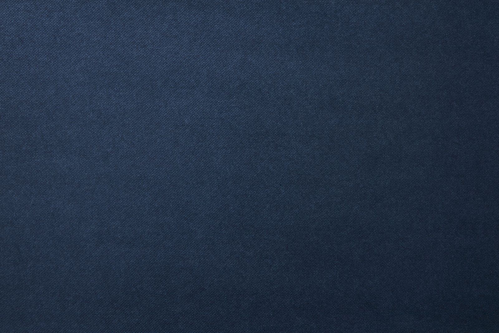 The image shows a dark blue textured fabric background with an even pattern and consistent color throughout.